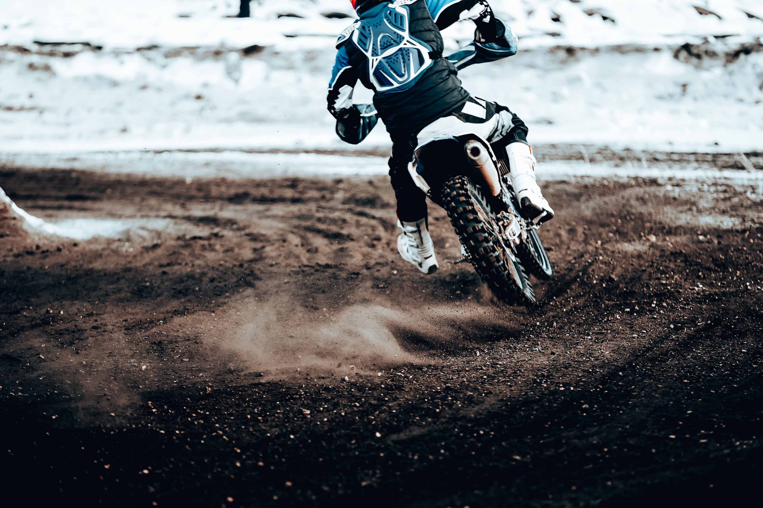 motorcycle racer enduro motocross riding on winter track