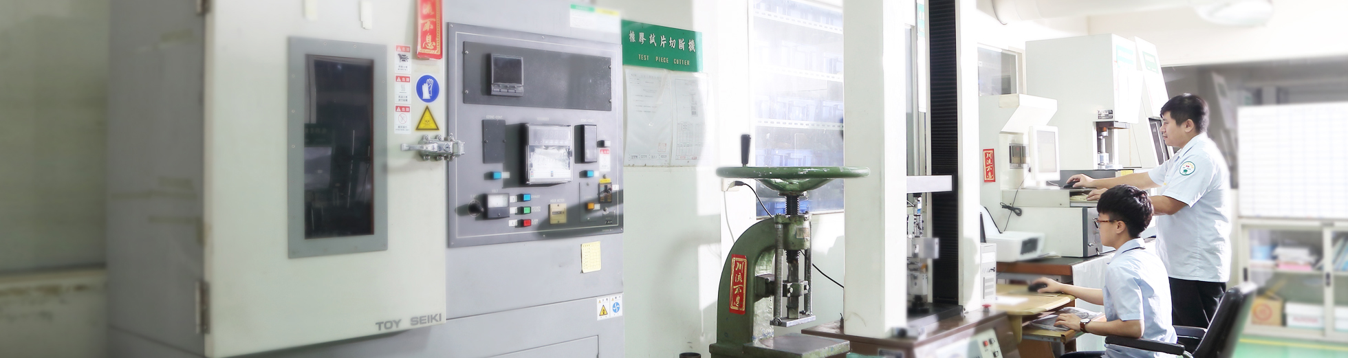 K.O.K. employees working in a laboratory using K.O.K. machines and computers